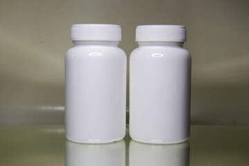 White plastic medical container Clearly for pills or capsules.Blank Slate