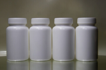 White plastic medical container Clearly for pills or capsules.Blank Slate