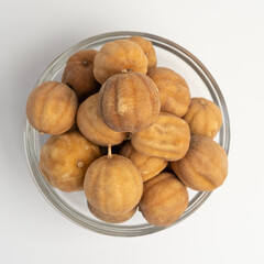 Sun Dried Lime in a glass dish on a white background
