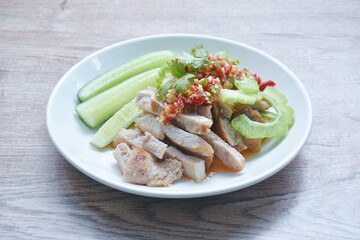 grilled pork slice dressing with lime garlic and chili sauce salad on plate
