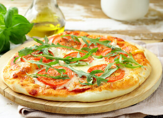 fresh delicious pizza with tomatoes and basil