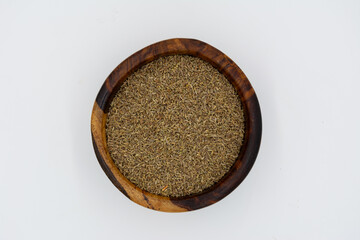 cumin seedsin brown wooden plate