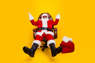 Fototapeta na wymiar Full body photo of old saint nicholas raised palms up showing empty space proposition christmas sale isolated on yellow color background