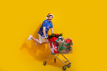 Full size profile photo of crazy guy jumping push market trolley pile stack newyear giftbox...