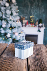 gift boxes in front of Christmas tree