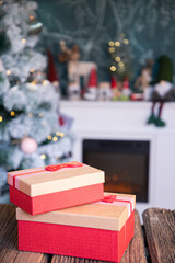 gift boxes in front of Christmas tree