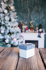 gift boxes in front of Christmas tree