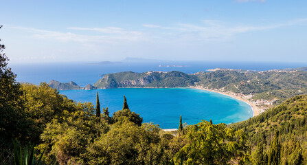 The sandy beach of Agios Georgios on the island of Corfu on a stormy day with high waves