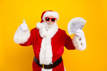 Photo of pensioner santa claus wear red traditional costume hold much money thumb up winner lottery...
