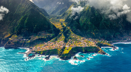 Aerial view of Madeira island. Land meets ocean in Seixal, Madeira, Portugal - Powered by Adobe