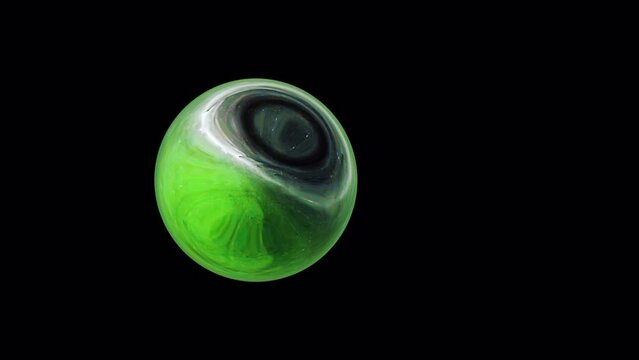 Abstract lime green alien planet star sphere moving from left to right on black background. Isolated alpha channel using Quick time proress 444