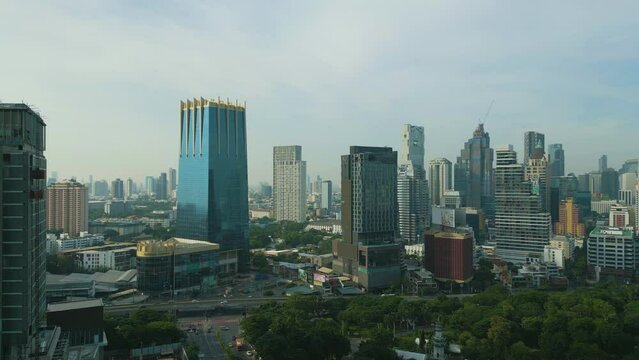 Aerial view city office building with green park Lumpini morning sunrise Bangkok Thailand