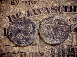 front and back view of 1 doit java coin. coins are made of tin.