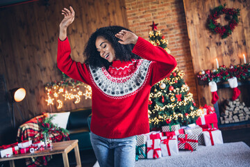 Portrait of positive charming girl dancing chilling cozy fairy christmas time evergreen tree lights apartment indoors