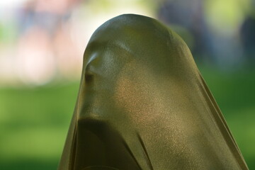 The man's face is covered with cloth. Masked man