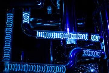 Glowing blue pipes showing a scale model of a modern nuclear reactor at a nuclear power plant