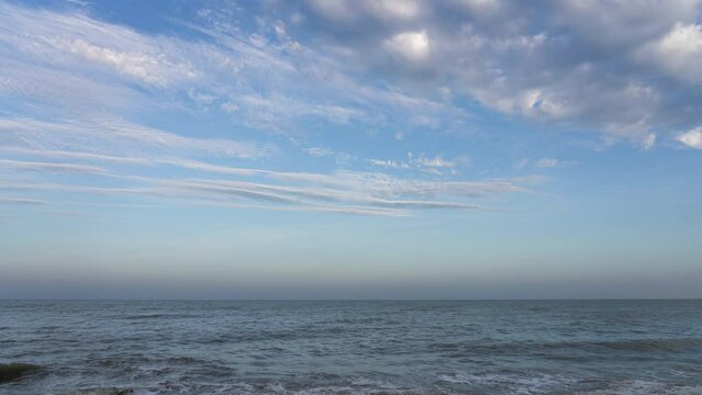 Time Lapse of Beautiful Sea and Sky with moving clouds at Daytime