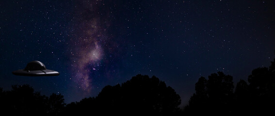 Milky Way and stars behind a UFO