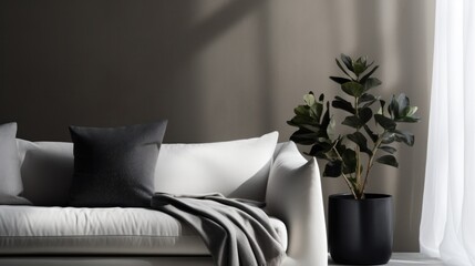 A white couch with a plant in a vase, adding a touch of nature to the elegant and minimalist living room decor.