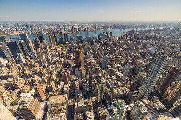 Breathtaking aerial perspective of Manhattan skyscrapers set against picturesque landscape of...