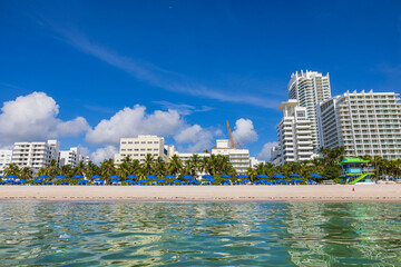 Beautiful sight of Atlantic Ocean's sandy beach featuring sun loungers and umbrellas set against...