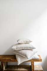 Cushions nd pillows in natural linen pillowcases after laundry