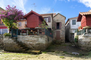 Fishing village of Combarro with the typical horreos (fish drying sheds). Galicia, Spain.