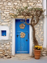 Fototapeta na wymiar a blue door with a flower and a basket