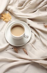 a cup of coffee, blanket and fall leaves