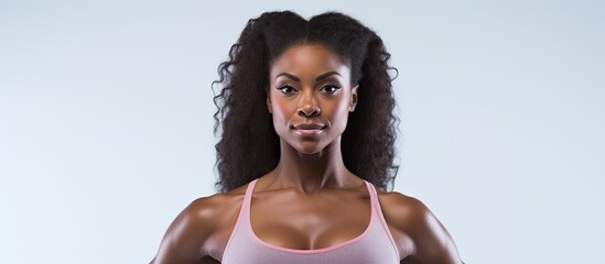 The isolated woman in the white background, a fitness enthusiast, is seen exercising in the gym, showcasing her commitment to health, beauty, and sport. The black girl's skin glistens with sweat