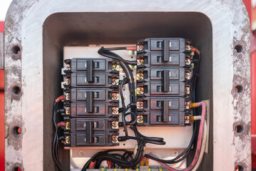 Circuit breaker controlling panel of the electric junction box for industrial use. Industrial and safety equipment object photo, selective focus.