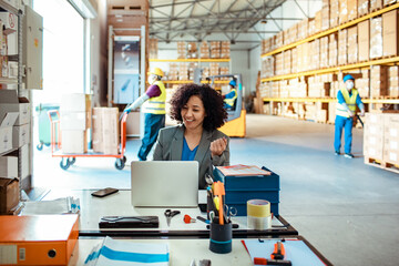 Logistics Manager Working in Warehouse Office