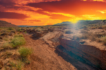 Enjoy the awe-inspiring beauty of nature's masterpiece at sunset. Witness the fiery red clay...