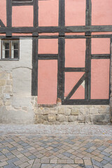Detail of a pink half-timbered house in Quedlinburg