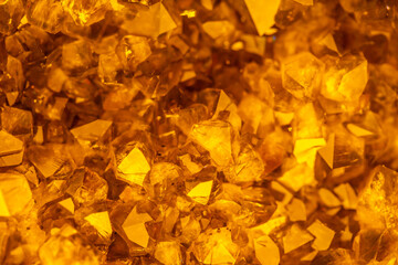Golden crystal mineral stone. Gems. Mineral crystals in the natural environment. Texture of...