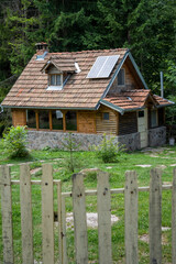 Fototapeta na wymiar Large wooden house - Log cabin in the forest on Stara planina in the village of Dojkinci.