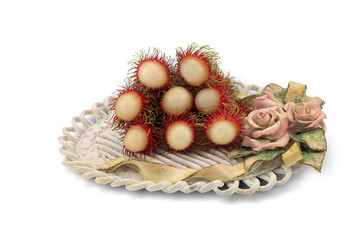Obraz na płótnie Canvas rambutan fruit in basket isolated on white background with clipping path.