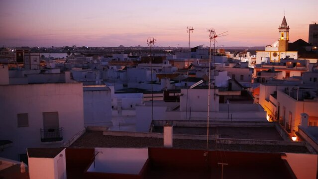 Traditional whitewashed Andalusian architecture at night in Ayamonte, Huelva, Andalucia, Spain, a picturesque blend of charm and history