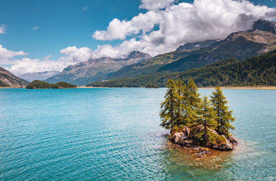 Great view on azure lake Silsersee (Sils) and peak Piz Corvatsch in the Swiss alps. Location Upper Engadine valley, Europe.