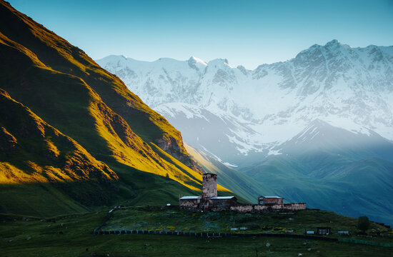 View of the Ushguli village at the foot of Mt. Shkhara. Location place Lamaria Church Jgrag, Upper Svaneti, Georgia, Europe.