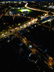 Fototapeta na wymiar Aerial View of Illuminated British City of England During Night