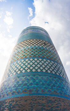 Facing of the Kalta Minar from glazed mosaic tiles in the ancient city of Khiva in Khorezm