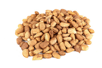 Delicious newly harvested shelled almonds. In shell roasted almonds on a white background. Almond nuts with shell texture and background top view.