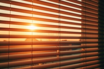 Sunlight shining through the blinds of a window. Perfect for adding warmth and natural lighting to any composition