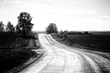 sand and gravel, country road, winding road, black and white, monochrome landscape, Latvia.
