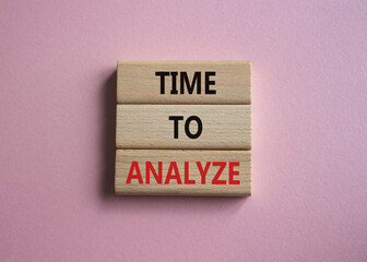 Time to Analyze symbol. Concept word Time to Analyze on wooden blocks. Beautiful pink background. Business and Time to Analyze concept. Copy space