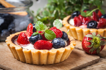Fresh homemade fruit tart with strawberries and blueberries.
