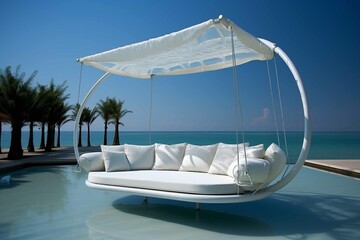 Fototapeta na wymiar Beautiful Swing sofa on the Swimming pool waters outdoor beach
