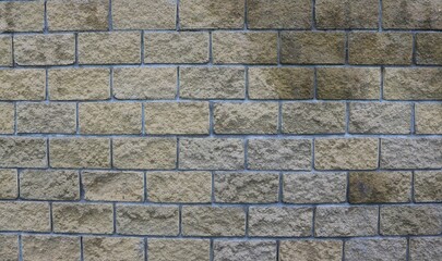 graphic resource of brickwork in brown and gray tones, with an uneven textured surface of lines and rectangles, brick backdrop with empty space for insertion
