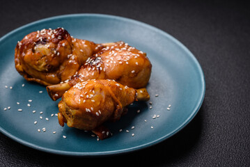 Delicious Asian dish with chicken legs in teriyaki sauce with salt and spices
